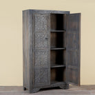 Side angle image with open door of a Vishyali hand carved grey mango wood wardrobe with geometric carved doors 180cm