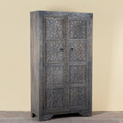 Side angle image of a Vishyali hand carved grey mango wood wardrobe with geometric carved doors 180cm
