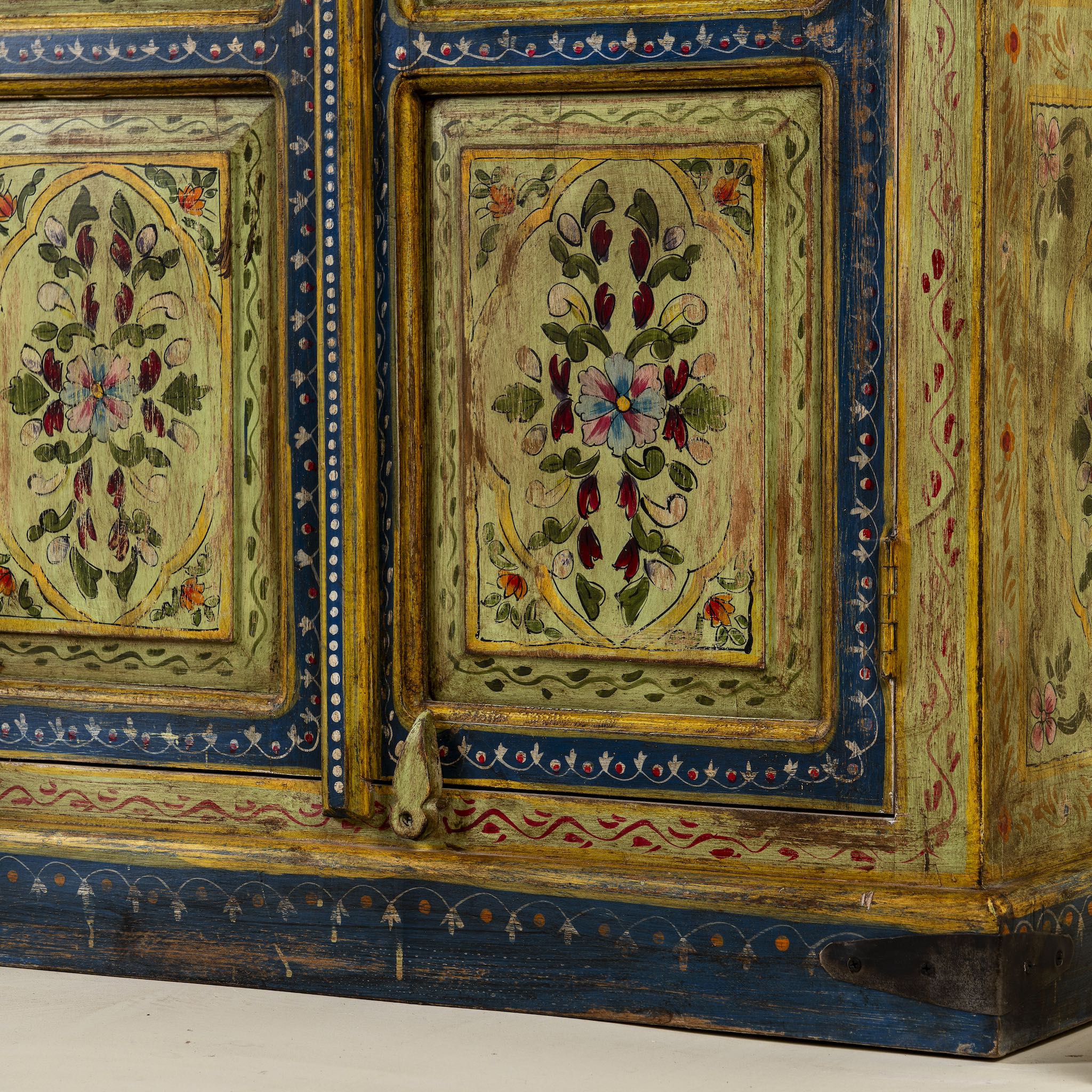 Close up image of a hand painted wardrobe made from reclaimed wood with floral motifs and distressed finish; ideal for a boho chic living room or eclectic bedroom, 90 × 40 × 150 cm.