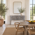 Lifestyle image of a console table wood with drawers and doors, ideal as an entryway table vintage statement piece.