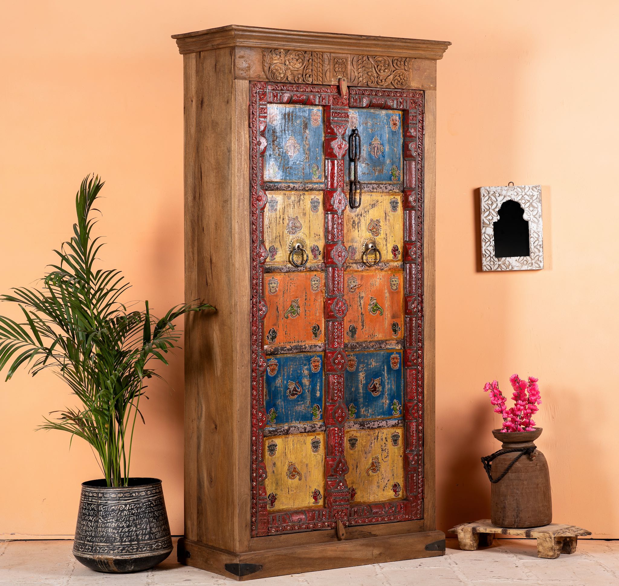 Side angle image of a hand-painted cabinet made from reclaimed teak wood with colourful Indian motifs – sustainable furniture and vintage teak wood craftsmanship for bold interiors.