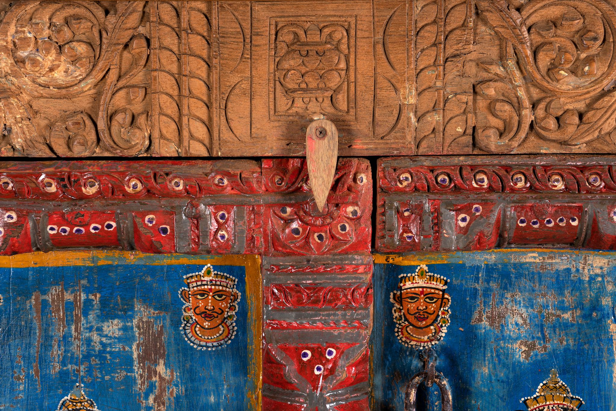 Close up image of a hand-painted cabinet made from reclaimed teak wood with colourful Indian motifs – sustainable furniture and vintage teak wood craftsmanship for bold interiors.