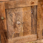 Close up image of a Yana set of two hand carved mango wood bedside tables with drawer and cupboard 65cm