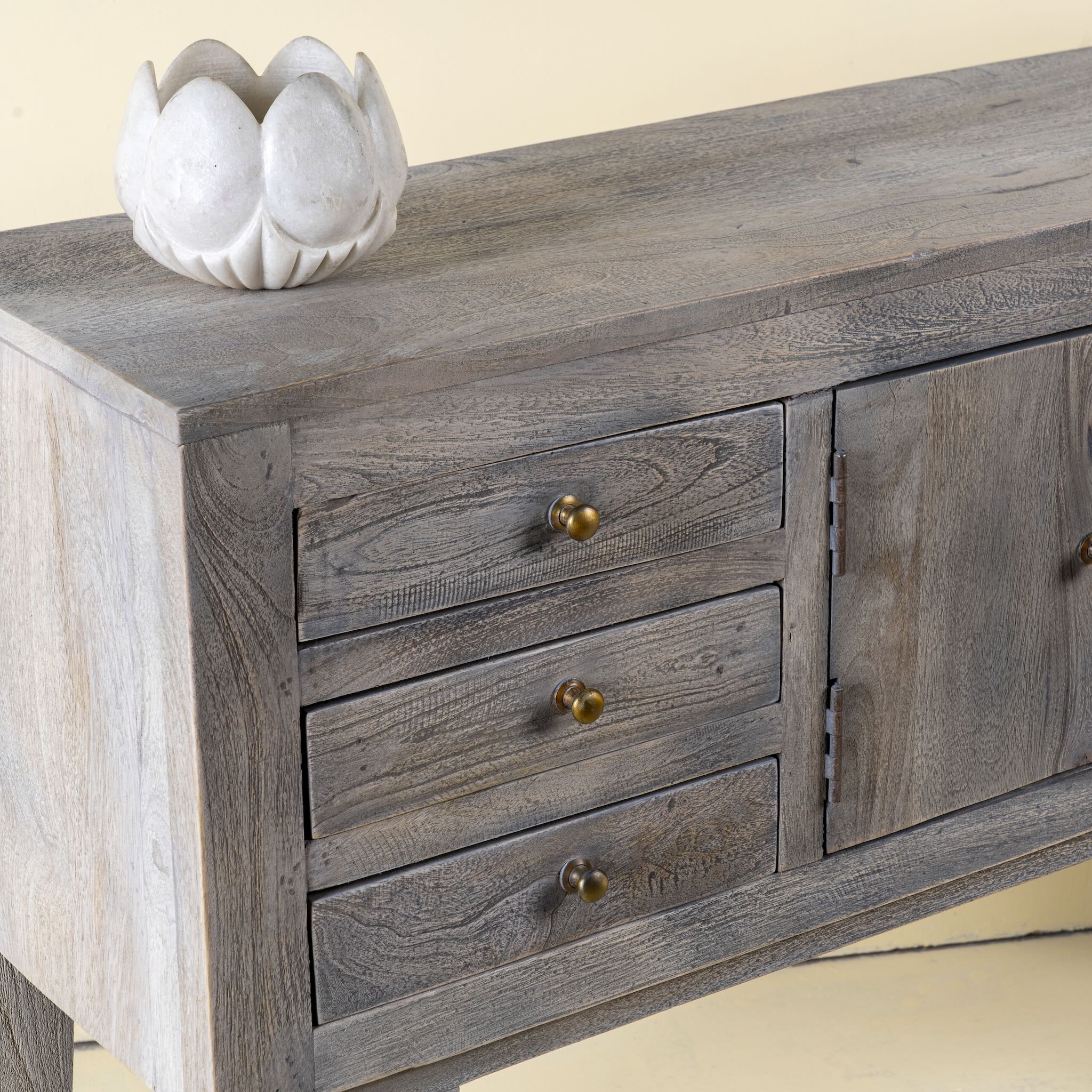 Hand-carved white marble vase Yatika in a lotus flower shape. A vintage home accessory crafted from natural stone, perfect for vintage home decor and small floral or incense displays.