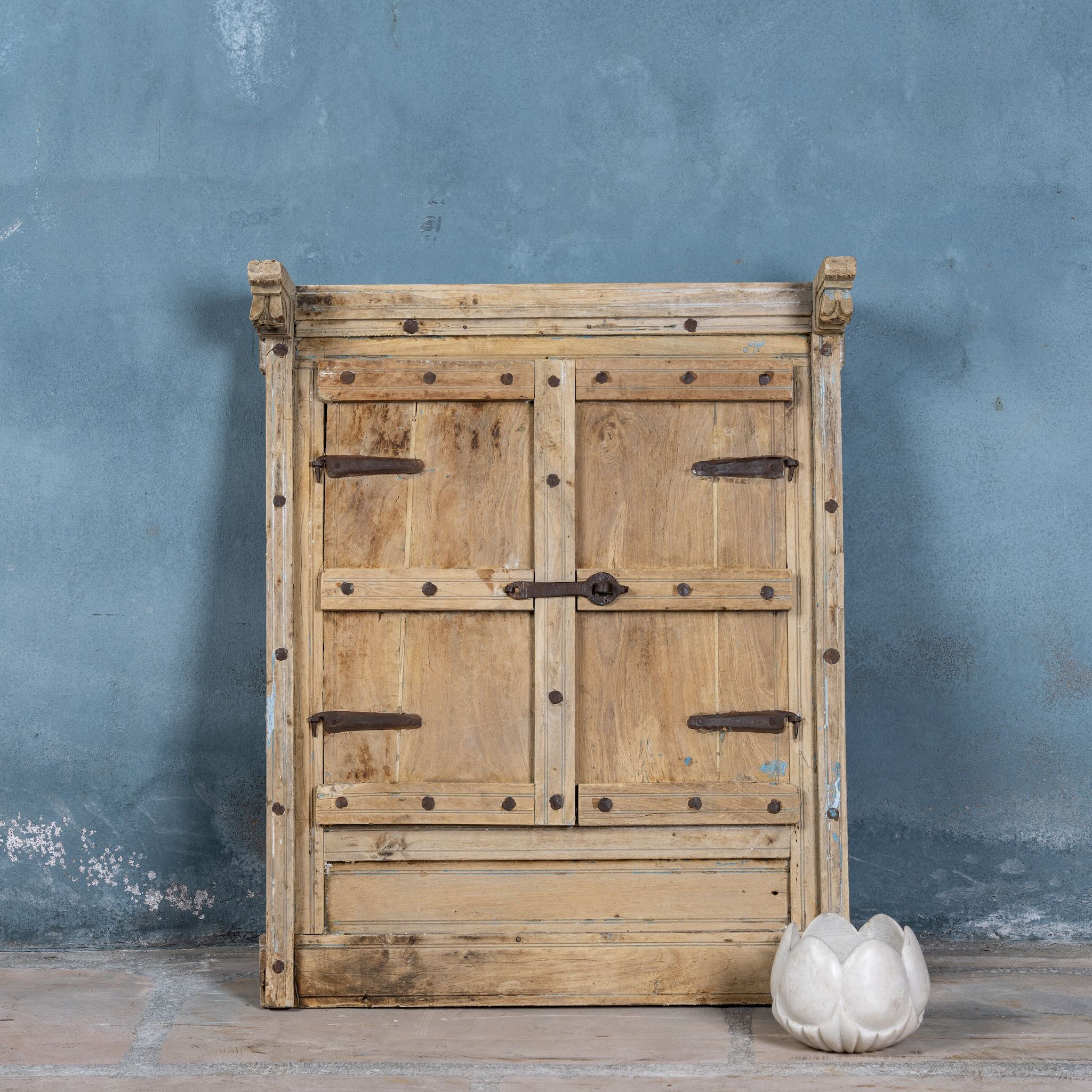 Hand-carved white marble vase Yatika in a lotus flower shape. A vintage home accessory crafted from natural stone, perfect for vintage home decor and small floral or incense displays.