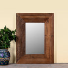 Image of a hand made reclaimed wood mirror in rustic design.