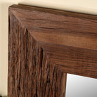 Close up image of a hand made reclaimed wood mirror in rustic design.