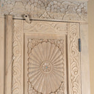 Close up image of a Zaina hand carved bleached reclaimed wood cabinet with floral carved doors 221cm