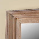 Close up image of a Zunaira reclaimed wood wall mirror with wide natural wooden frame in Ibiza style 140cm