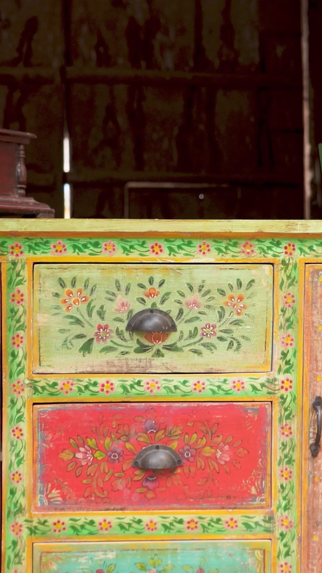 Reel showing Atri, a sustainable hand painted sideboard made from reclaimed teak wood with floral motifs; bold bohemian furniture, 150 × 45 × 90 cm.