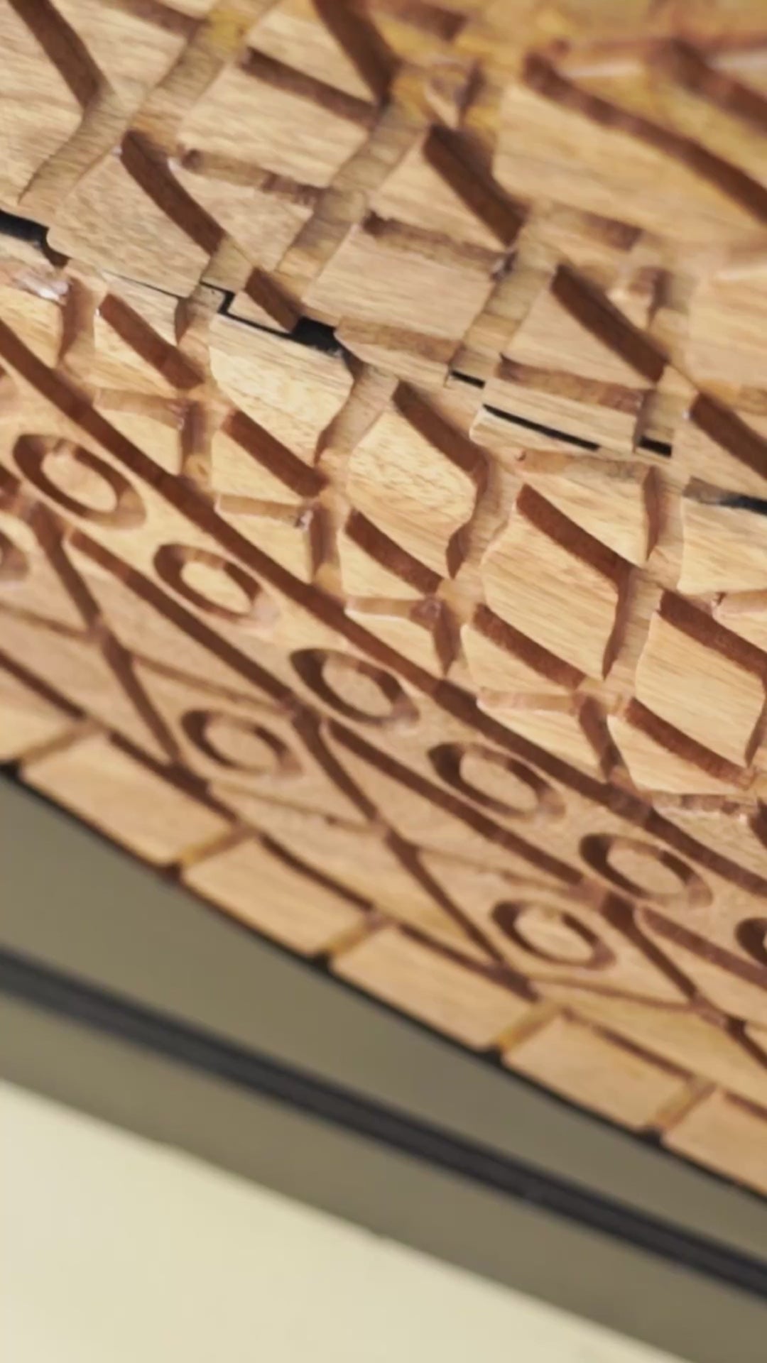 Reel showing Aakav mandala carved wood chest with black frame and natural carved mango wood drawers, mango wood drawer chest for modern bohemian interiors, 120 × 47 × 110 cm.