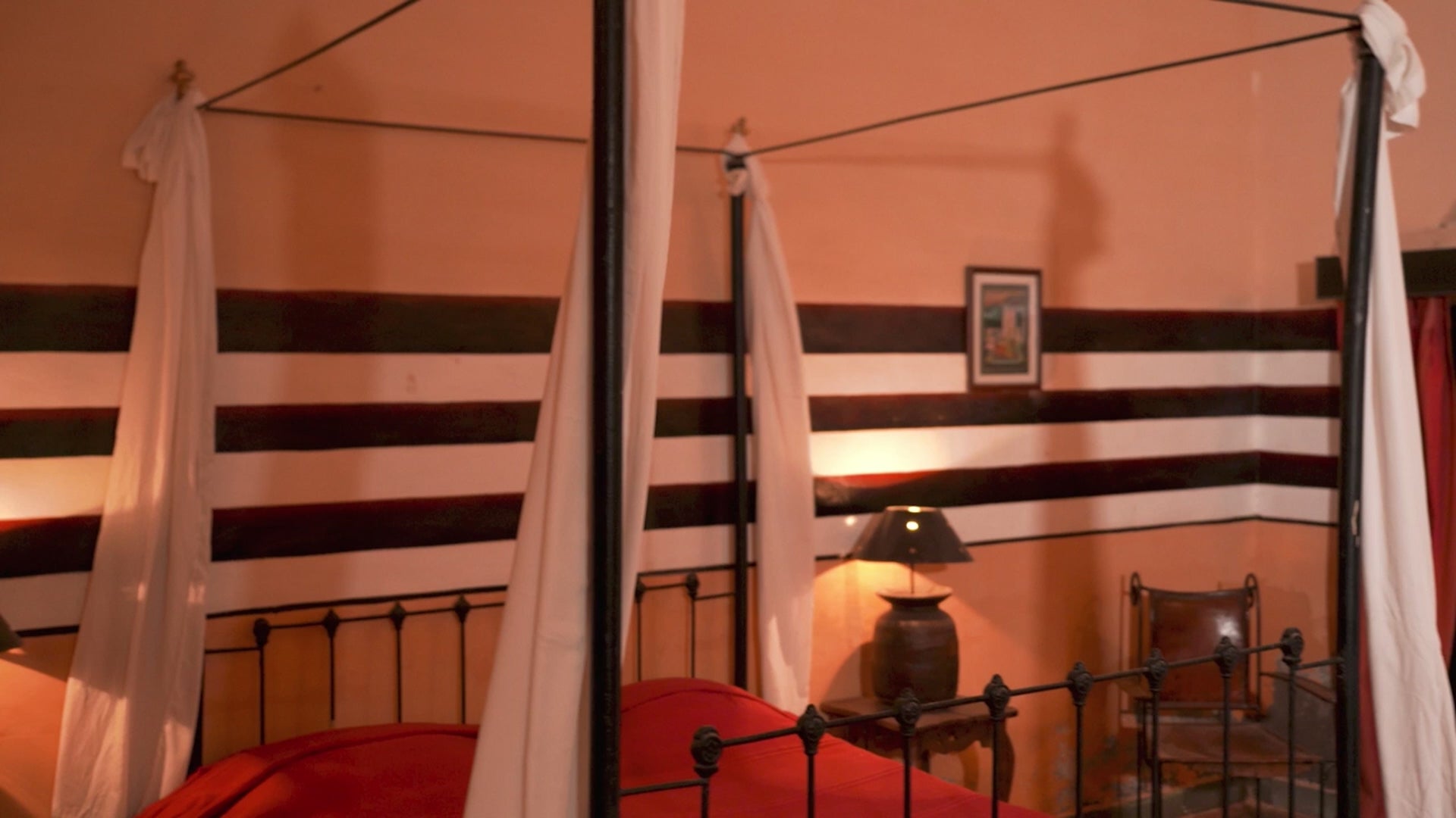 Video of Ambalika hand carved lowboard in mango wood, a stylish mango wood TV unit with whitewashed floral design.