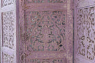 Close up image of a Alag Violet hand carved mango wood folding room divider with decorative carved panels 180cm