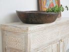 Close up image of a mango wood console table with Oriental hand-carved front; Mediterranean style carved console table with two storage compartments, 150 × 90 × 40 cm.