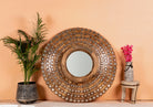 Round mango wood mirror Babra with concentric carved design and mirror inlays. A piece of unique wall decor combining artisanal craftsmanship and rustic bohemian charm.