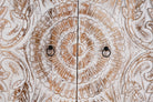Close up image of a Cheyyur handcrafted solid mango wood wardrobe with hand-carved whitewashed doors, large storage drawer, traditional Indian detailing, and natural wood grain, 190cm.