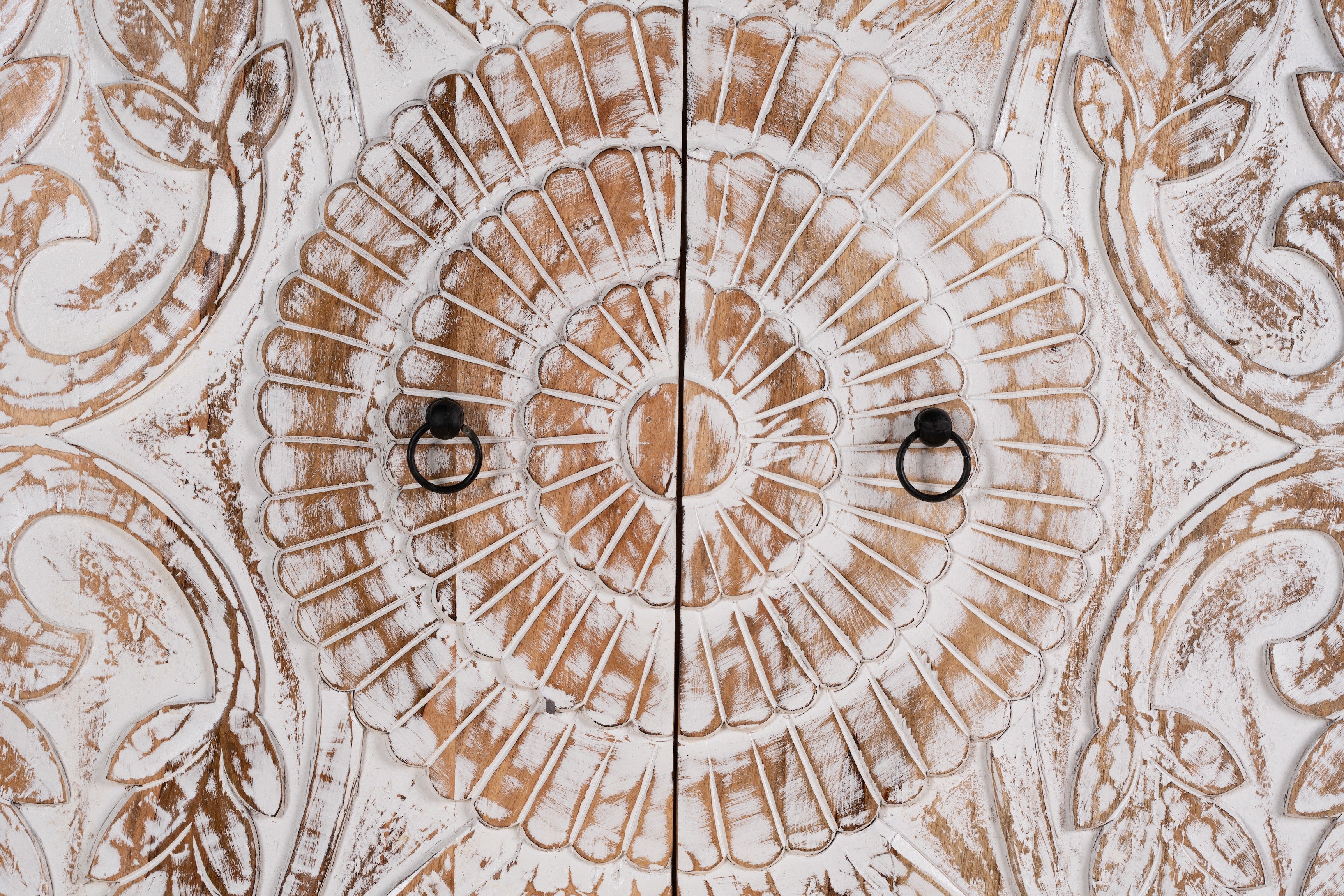 Close up image of a Cheyyur handcrafted solid mango wood wardrobe with hand-carved whitewashed doors, large storage drawer, traditional Indian detailing, and natural wood grain, 190cm.