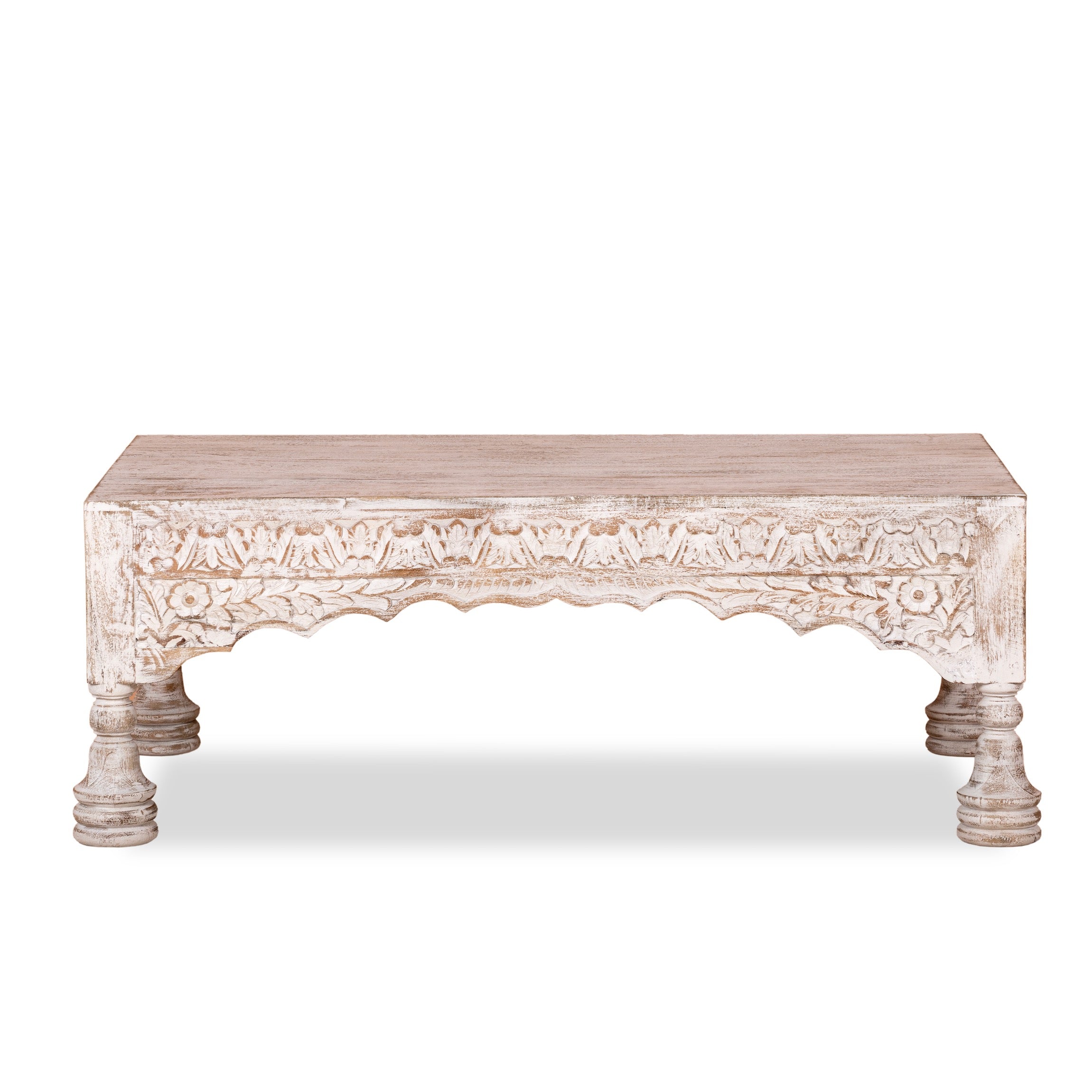 White background image of a Dhola handcrafted solid mango wood coffee table with intricately hand-carved floral patterns, natural wood grain, and artisan craftsmanship, 120cm.
