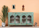 Jesar handcrafted turquoise-washed carved wooden sideboard with Indian motifs and open compartments; ideal as living room furniture or carved showcase, 180 × 100 × 40 cm.