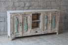 Side angle image of a Jhund hand carved mango wood sideboard with blue fish motif doors 184cm