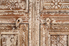 Close up image of a hand-carved mango wood cabinet with three drawers and vintage distressed finish; ideal for mango wood furniture lovers and vintage home decor, 150 × 110 × 40 cm.