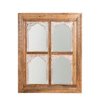 White background image of a hand-carved custom mirror Limbdi made from solid mango wood with floral motifs. A statement wooden wall decoration blending artisanal design with natural charm.