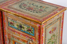 Close up image of a set of two hand painted bedside tables with floral motifs; sustainable furniture made of recycled wood, 45 × 35 × 70 cm.