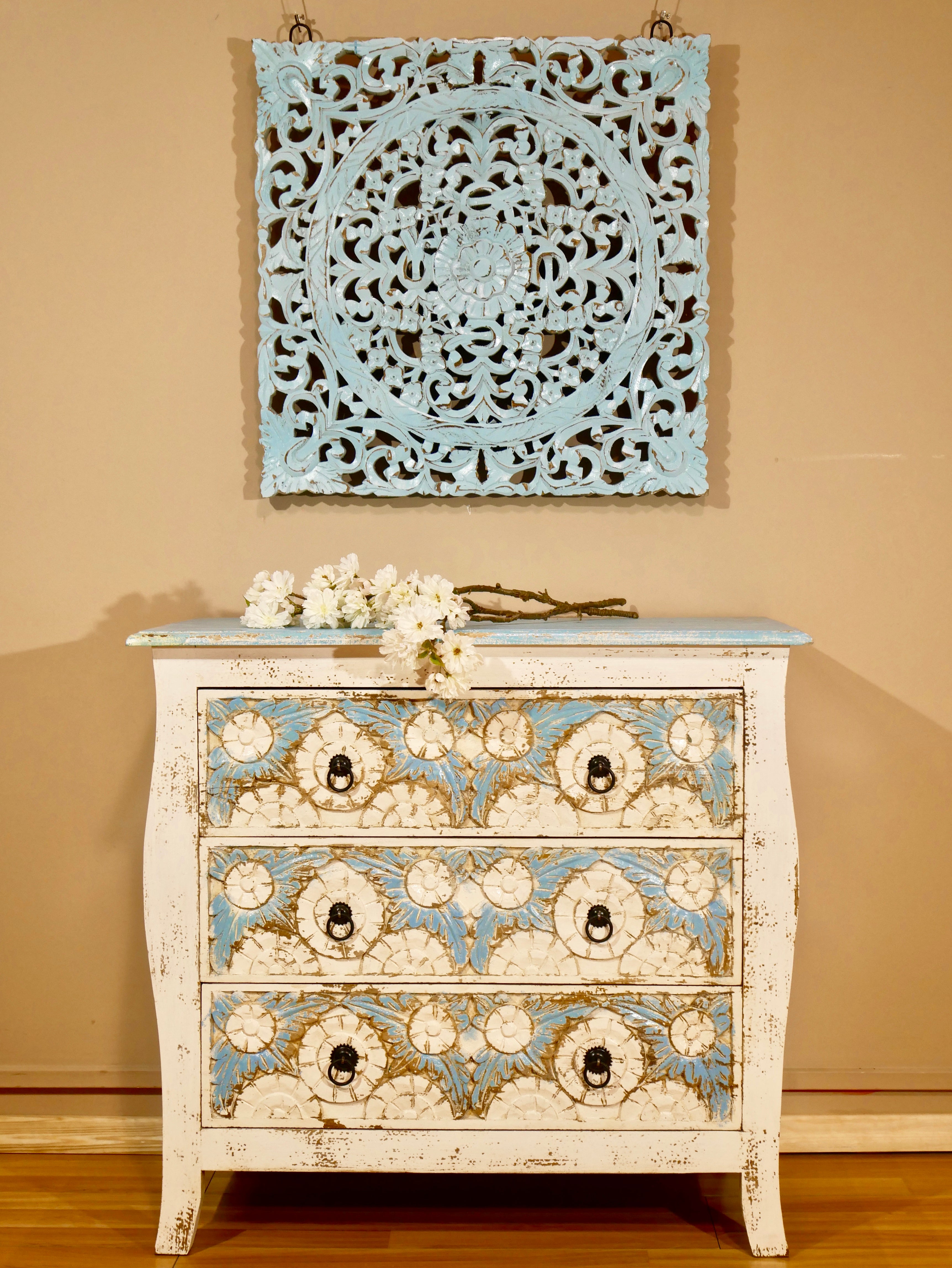 Boho style carved drawer chest made from solid mango wood with floral hand-carved details, Mediterranean design, 80 × 75 × 35 cm.