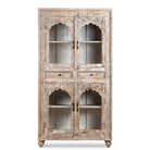 White background image of a hand-carved mango wood showcase with glass doors and drawers – carved wooden furniture in distressed turquoise and blue, combining artisan detail with vintage charm.