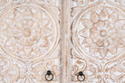 Close up image of a hand-carved mango wood wardrobe with whitewashed finish; wooden wardrobe perfect for living room furniture or bedroom storage, 180 × 90 × 40 cm.