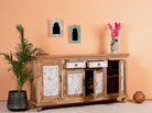 Side angle image with open doors of a Talaja handcrafted solid mango wood sideboard with intricately hand-carved doors, natural wood grain, traditional Indian patterns, and spacious storage, 180cm.