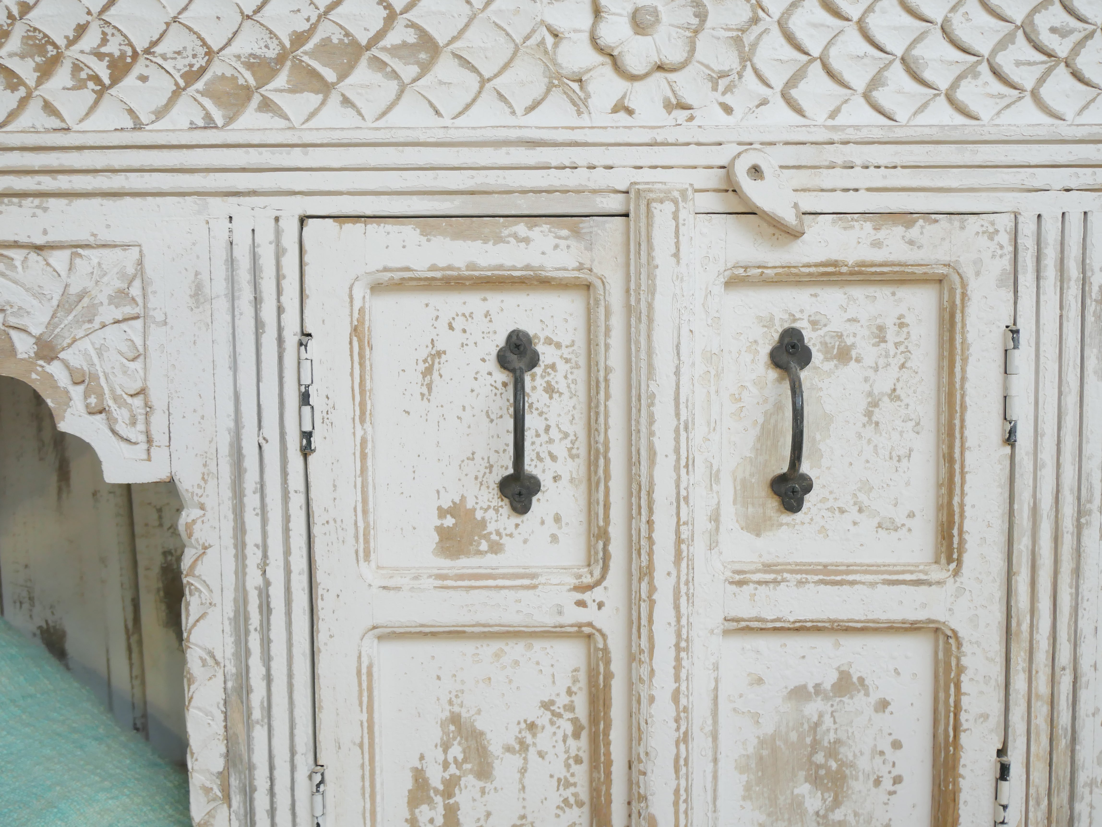 Close up image of a Teerth hand carved white washed mango wood console table with natural wood top 150cm